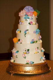 Spring-florals-buttercream-wedding-cake-gumpaste-hydrangeas-plumeria-petunia-wafer-paper-peonies--pink-purple-yellow-blue