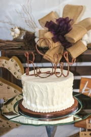 White textured buttercream rustic monogram wedding cake